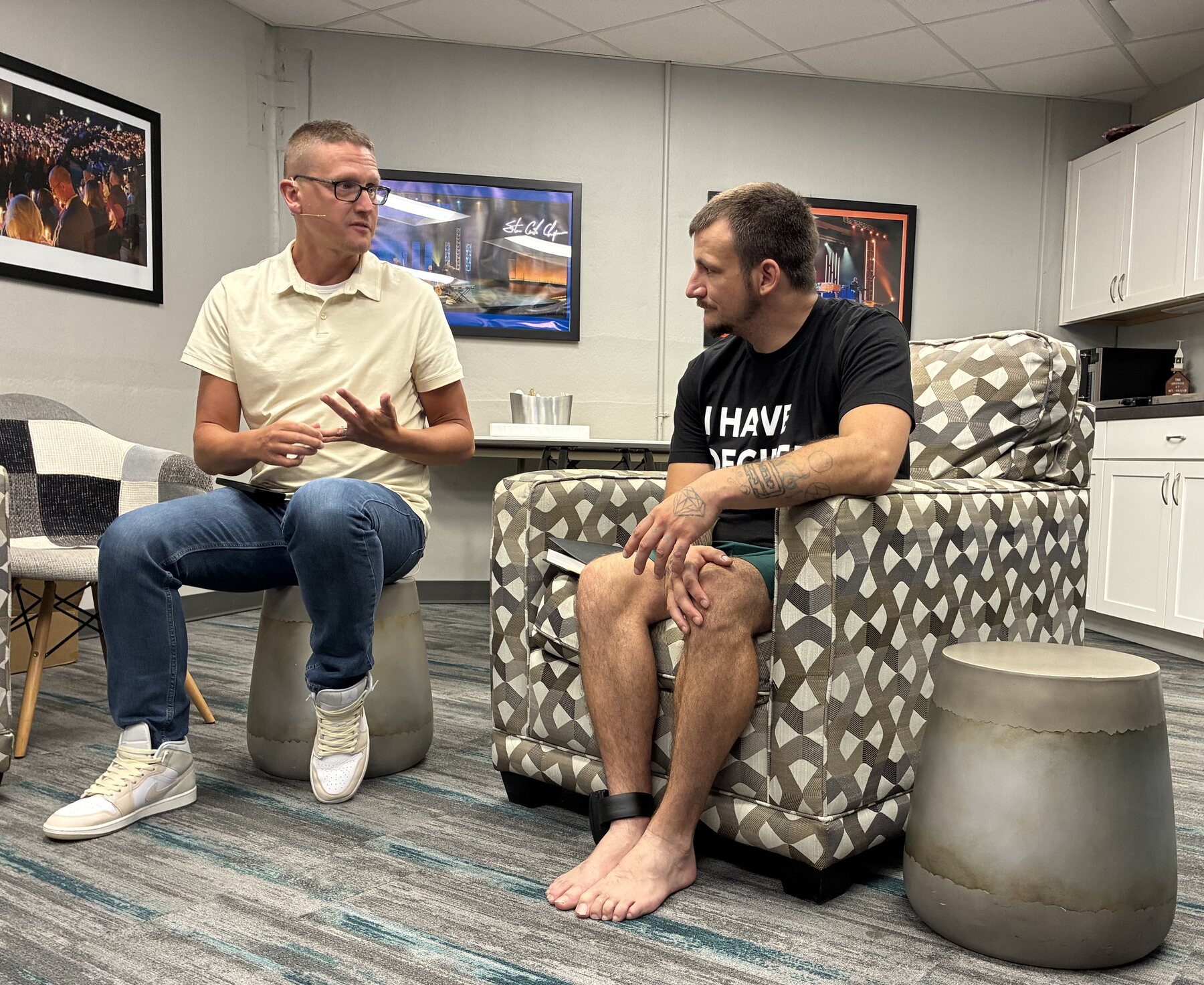 Two recovery ministry leaders talking together in a local church